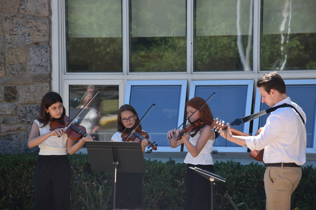 Bayville Intermediate School students and music teacher Ryan O’Flanagan performed for the students and staff at the unveiling of the mural.