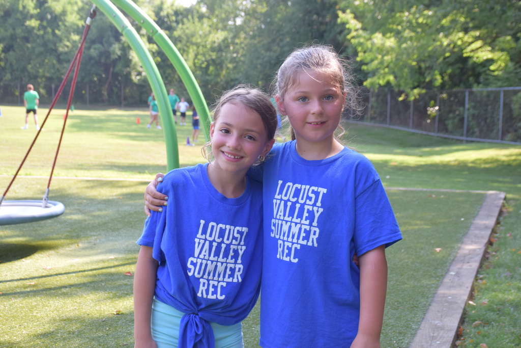 Two summer recreation campers enjoy a moment.