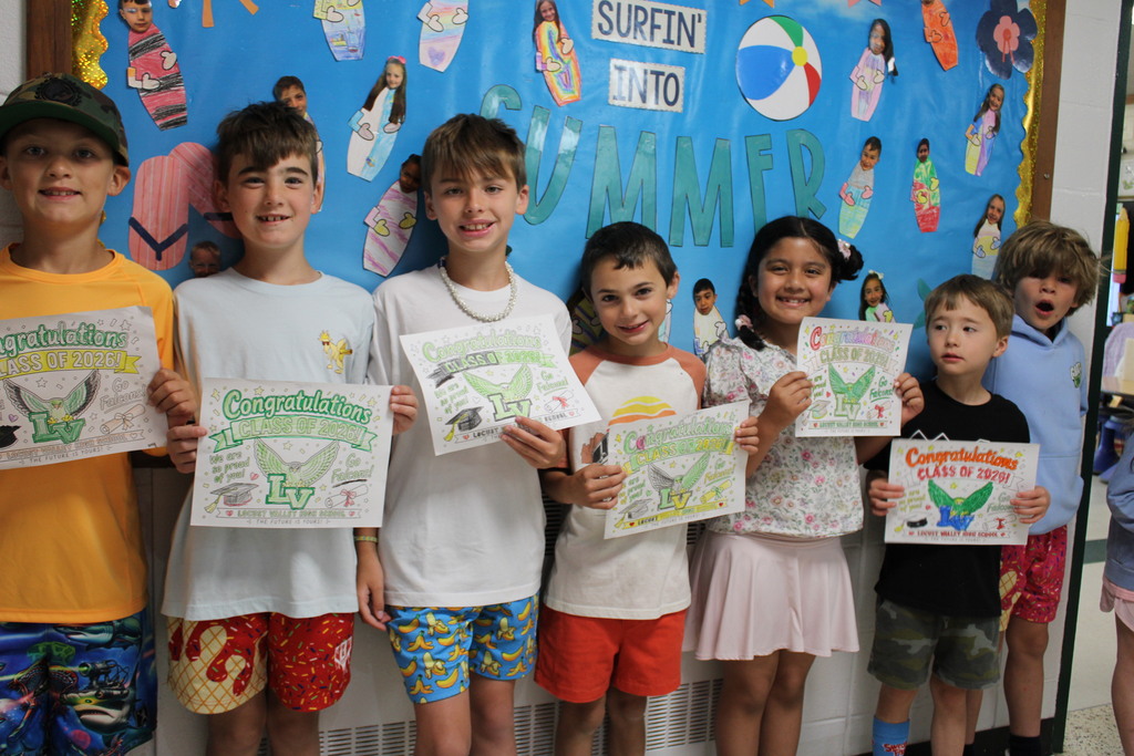Ann MacArthur students cheer on the Class of 2026 at the senior stroll.