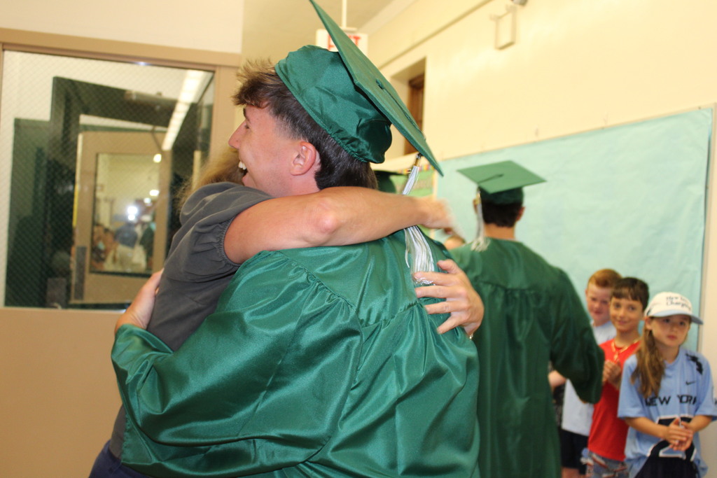 A member of the Class of 2026 embraces a teacher at LVI.