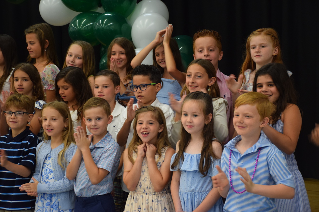 BP second graders sing to their guests at their graduation.