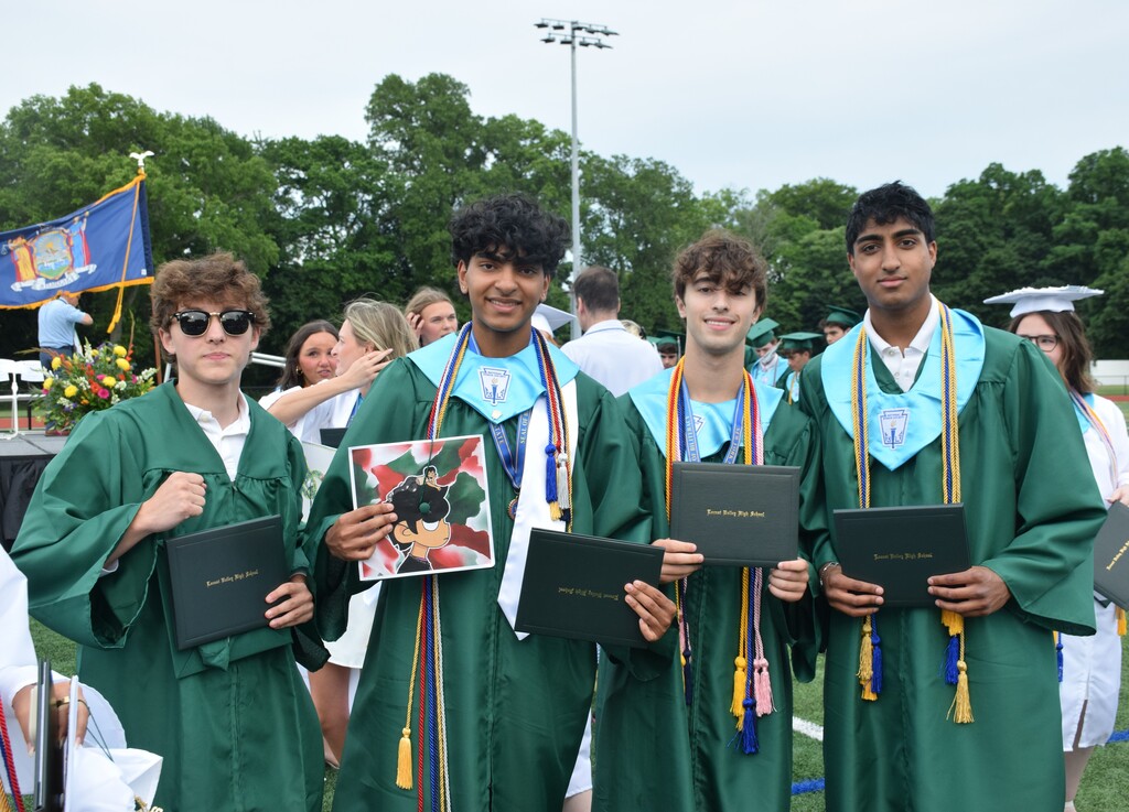 Seniors Jordan Acevedo, Adhvaith Sreenivas, Evan Rafiy and Aman Arora (left to right) showed off their diplomas after the ceremony.