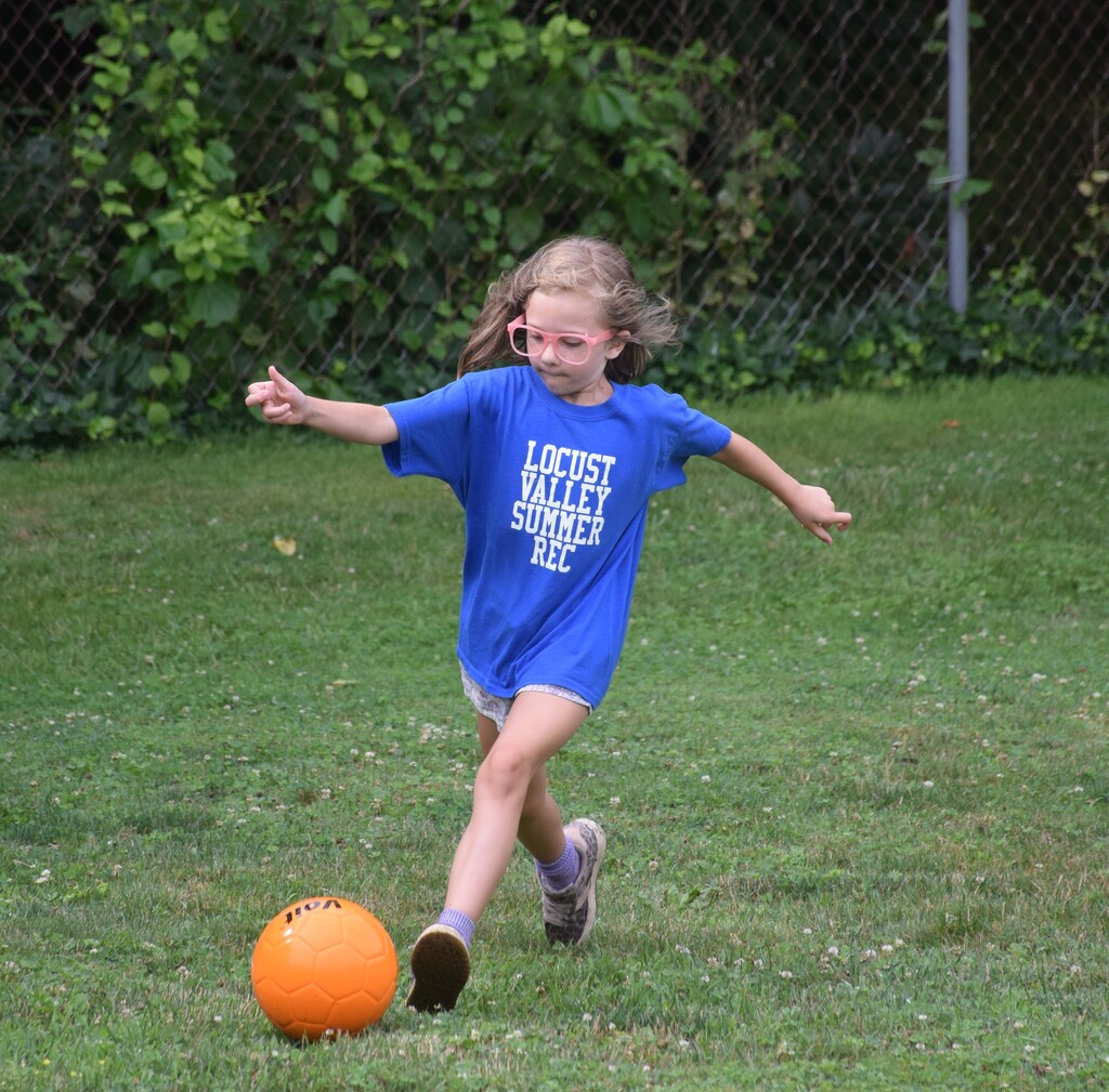 A Summer Recreation camper kicks a soccer ball at Fitness Fun Day 2026.