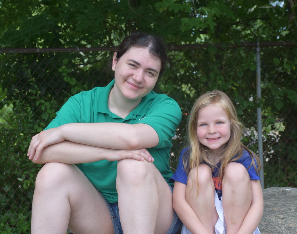 A Summer Recreation counselor and camper enjoy a break at Fitness Fun Day 2026.