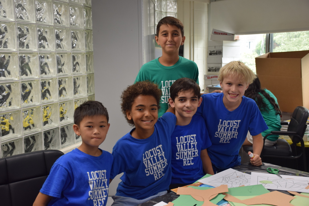 Summer Recreation campers make crafts with their counselor in July 2026.