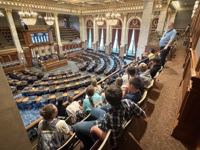 Fifth grade students visiting the Iowa Capitol building and seeing the Iowa House of Representatives legislative floor.