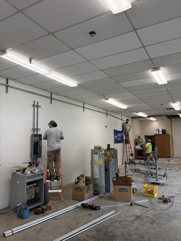 Electricians running wire for Hope Gas classroom