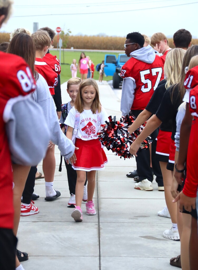 This morning, our high school cheerleaders and football players welcomed our elementary students 