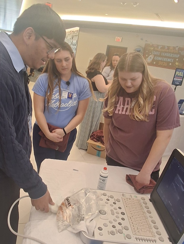  Leo Arellano learning about sonography from students at Metro Community College.