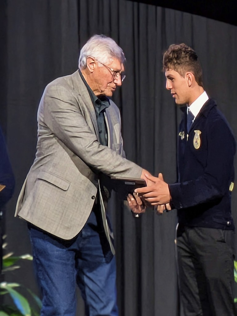 Tregan receiving award for proficiency