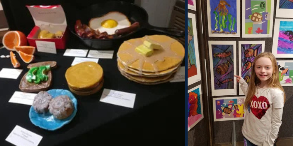 A young girl poses for a photo next to her art work on display for an art show. 