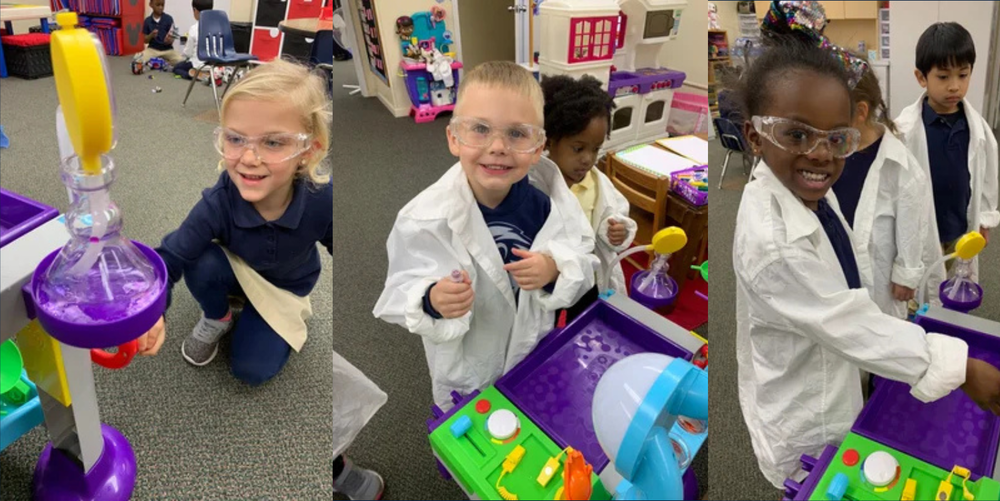 Three young students  smile while doing a STEM project in class.