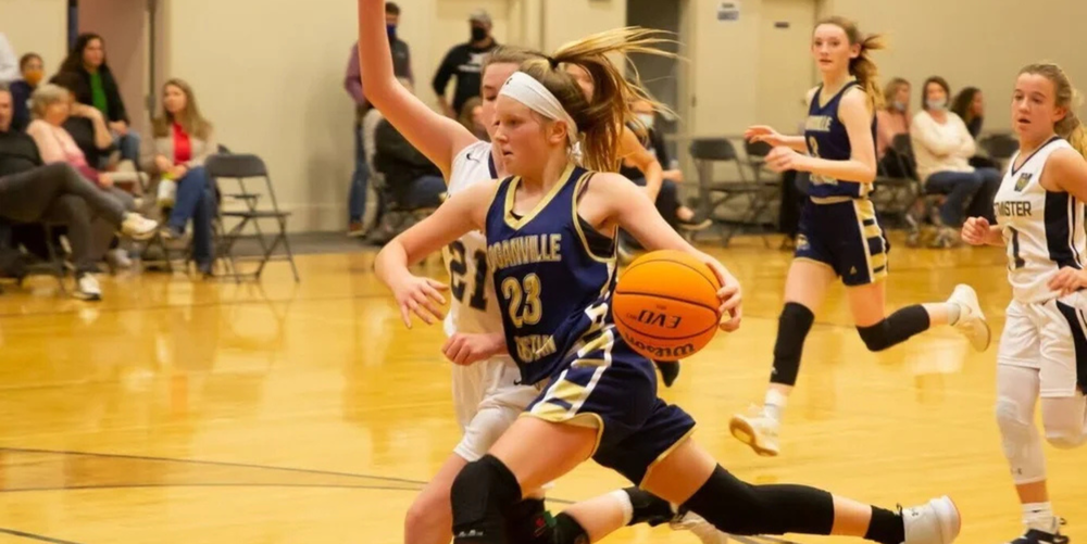 Lindsey Petitt advances the basketball down the basketball court during an Loganville Christian Academy basketball game.