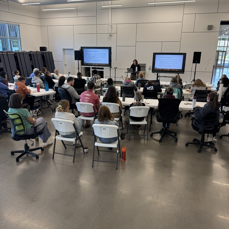 Certified staff learning during the PIR day. Megan Morris presents  