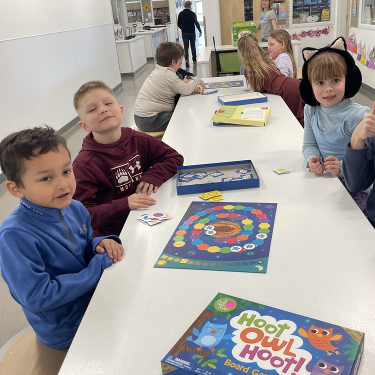 A group of students play a board game