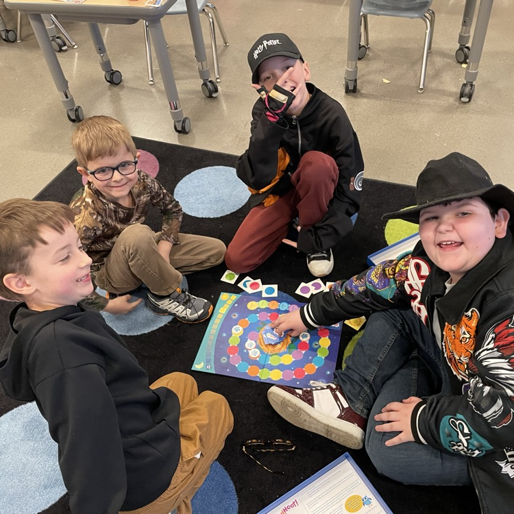A group of students play a board game