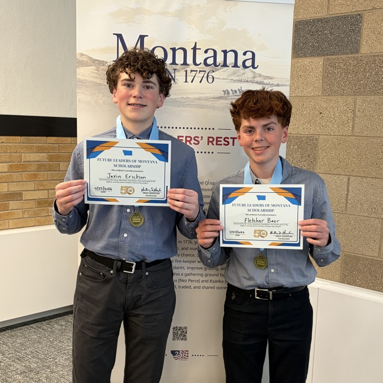 Jaxin and Fletcher holding their awards 