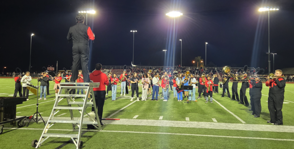 6 - 12 grade Band Performs at London v JA game