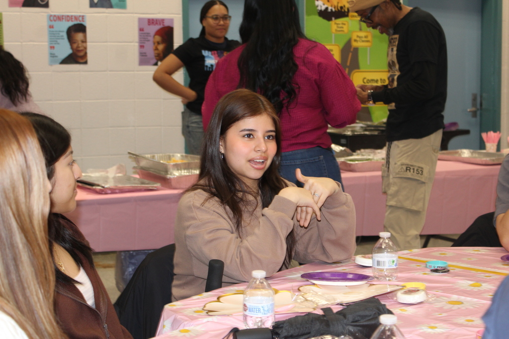 Students ask questions at the Chat and Chew 