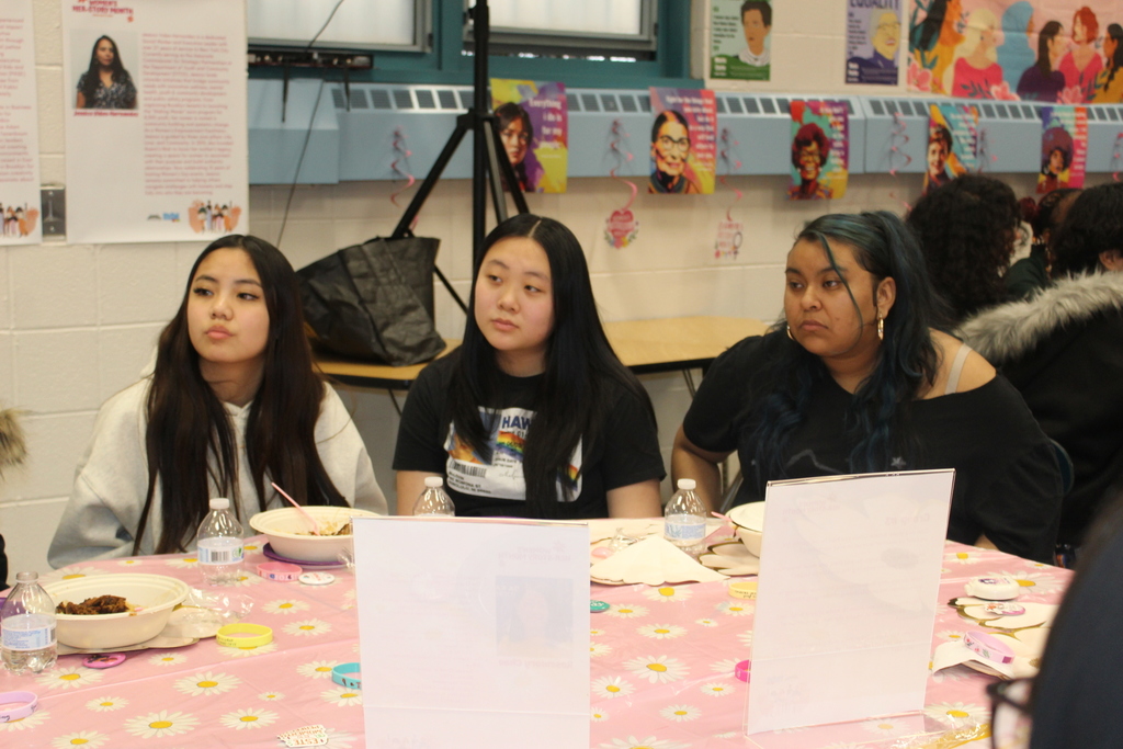 Students listen attentively to a guest speaker at the Chat and Chew