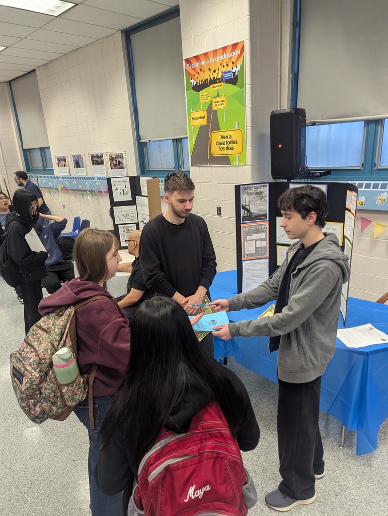 College Now Instructors and current students talk to interested students regarding College Now Course Offerings at LICHS!