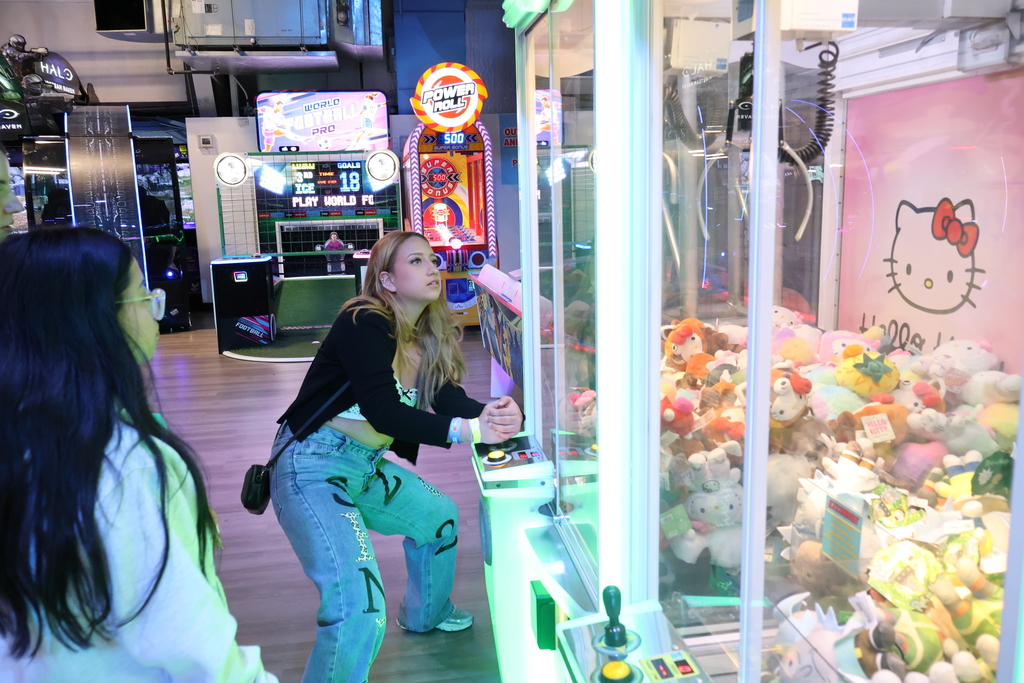 Students try their luck at the claw machine! 