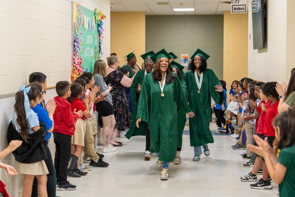 Longview seniors take victory lap through elementary schools