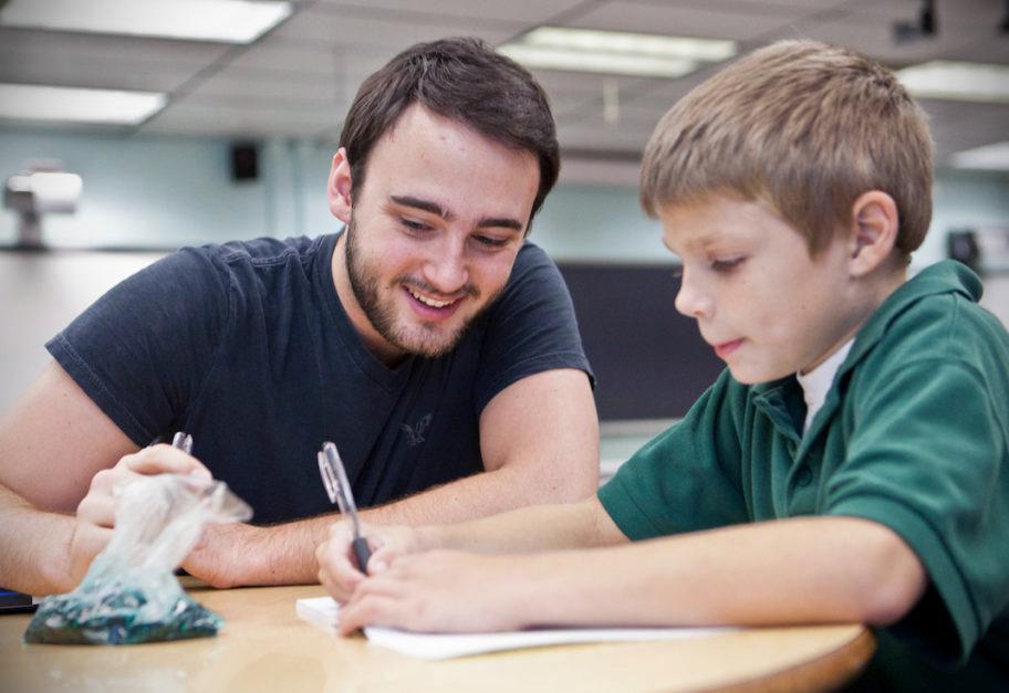 Parent working with student