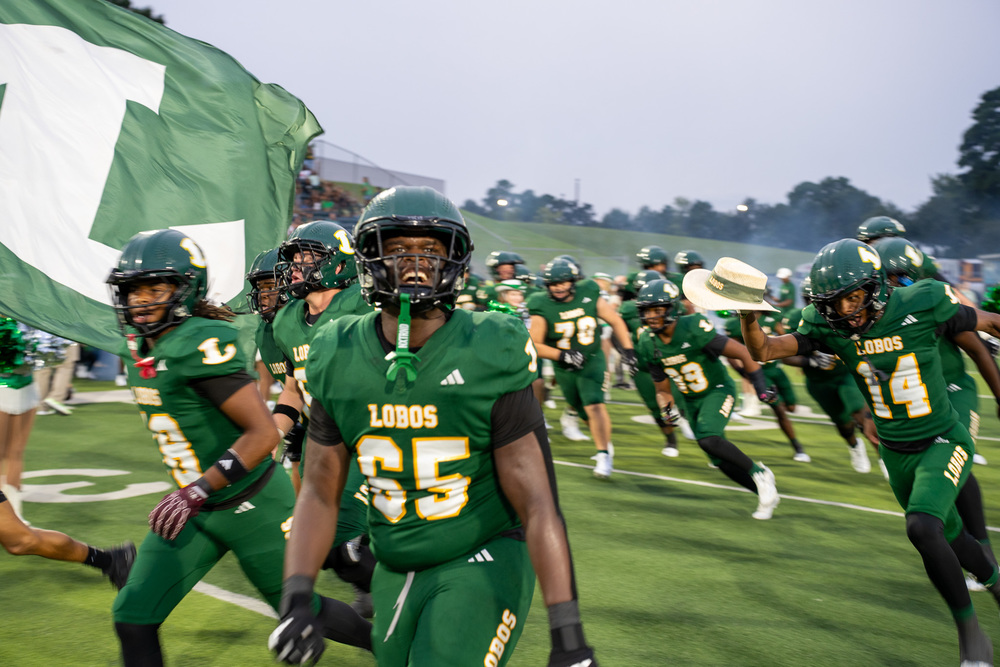longview lobos running out on the field