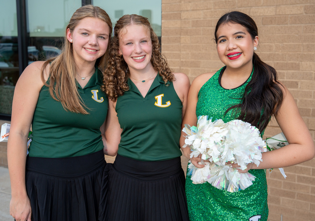 Cheerleaders and Viewettes greeting at the door to Chick-fil-A.