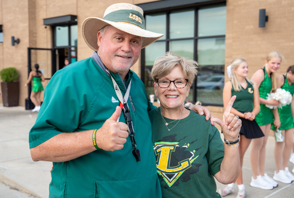 Coach King and Kay Ray supporting the Lobos.