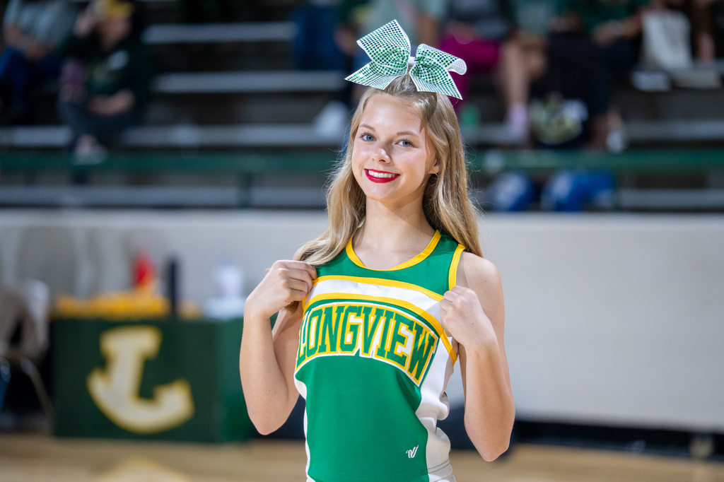 Cheerleader showing off her Longview uniform.