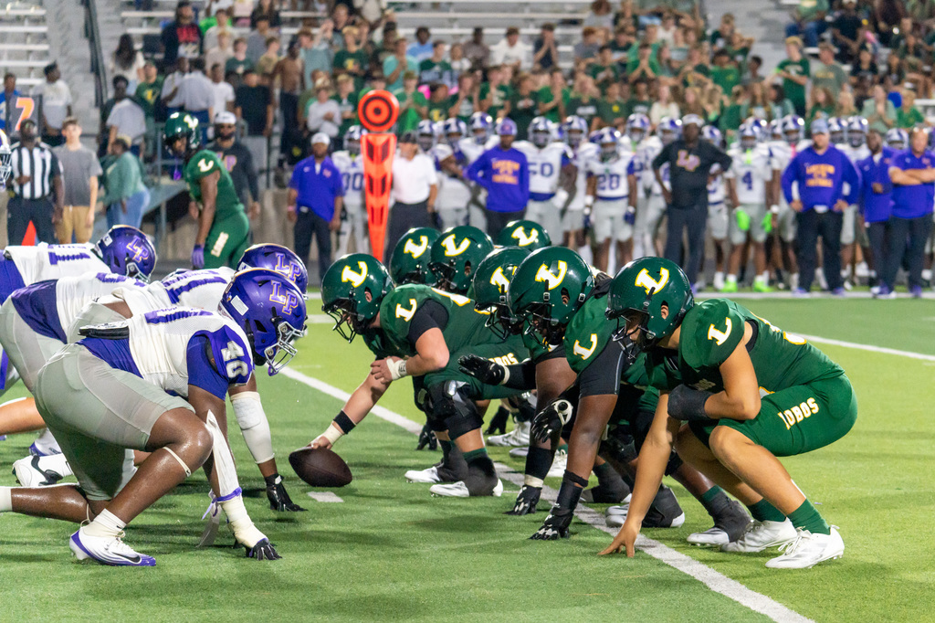 Longview center getting ready to snap the ball.