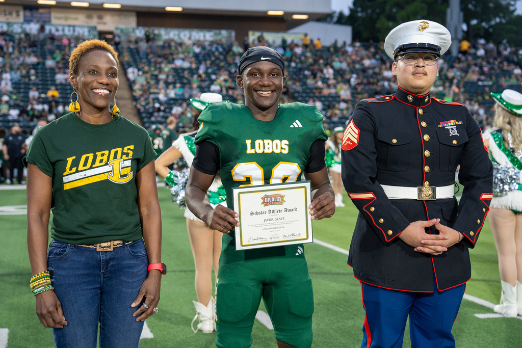 J. Glave celebrating Great American Rivalry Series Scholar Athlete