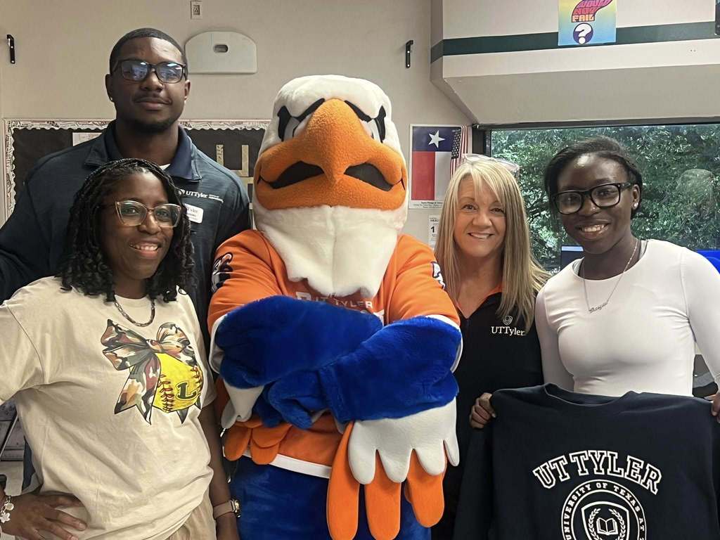 student with swoop mascot