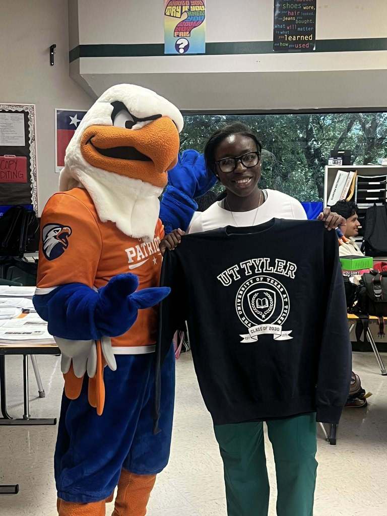 student with swoop mascot