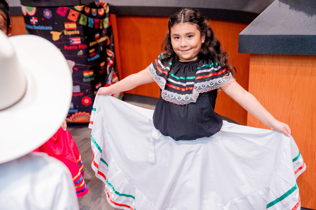 Students dancing to La Respa in the Hispanic Heritage Program at the ESC.