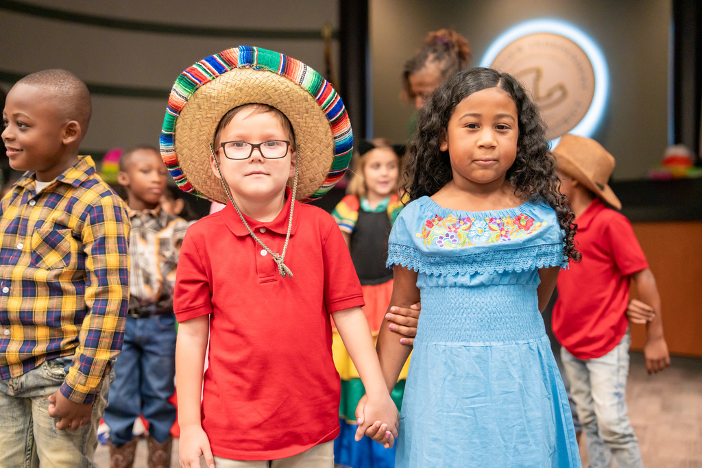 Students dancing to La Respa in the Hispanic Heritage Program at the ESC.