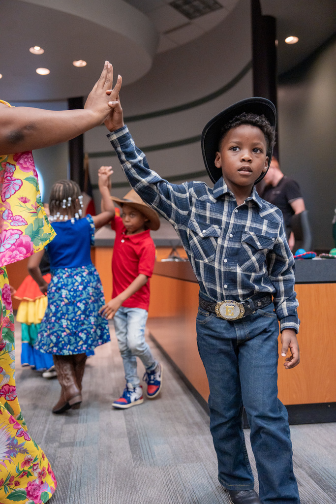 Students dancing to La Respa in the Hispanic Heritage Program at the ESC.