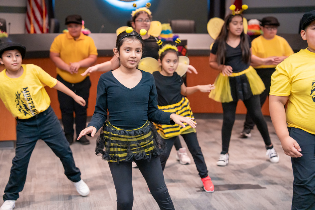 Students dancing in the Hispanic Heritage program at the Education Support Center.