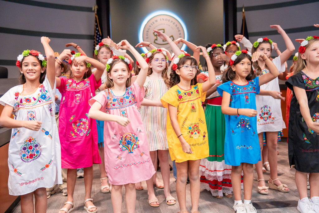 Hudson Pep students singing in the Hispanic Heritage program at the Education Support Center.
