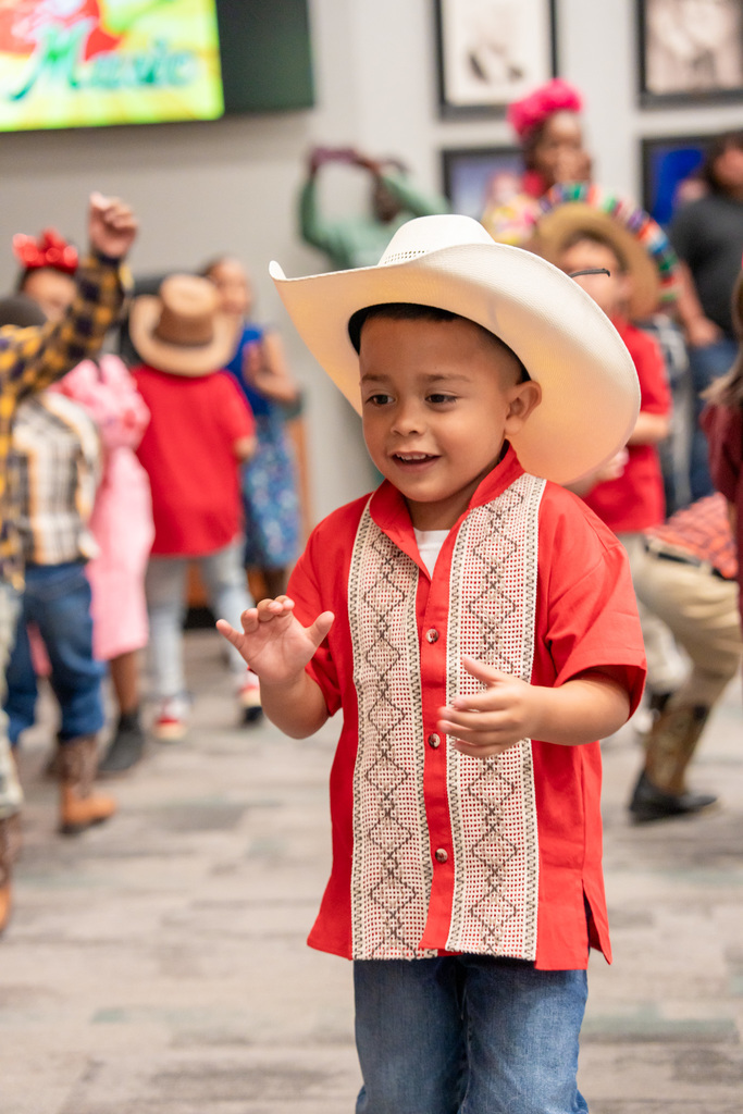 Students dancing to La Respa in the Hispanic Heritage Program at the ESC.