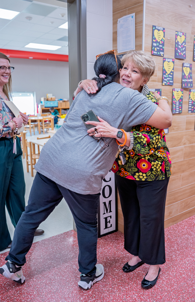 East Texas Montessori Prep Academy teacher hugging Longview ISD Foundation Executive Director.