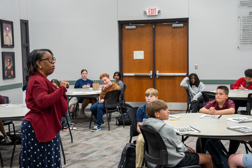 Superintendent talking with students.