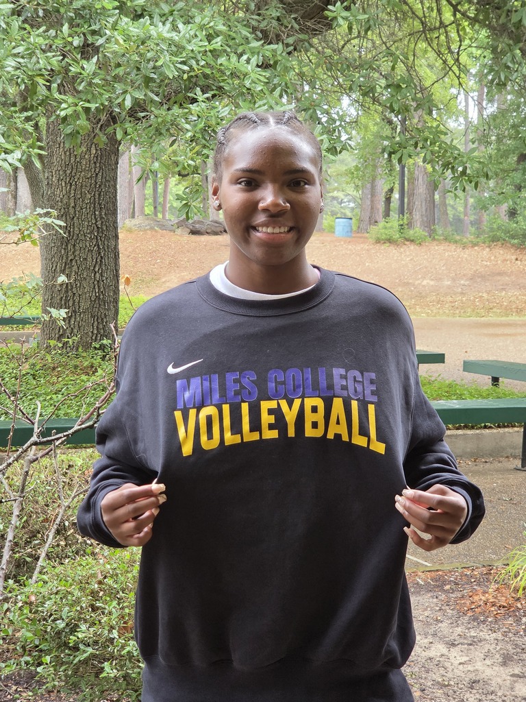 Jaharia proudly showing off her Miles College Volleyball sweatshirt. She will be playing there in the fall.