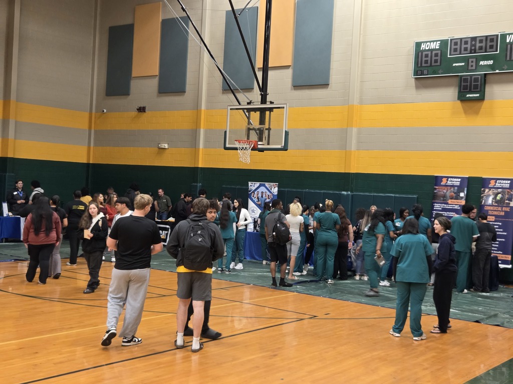 Students interacting with various career booths
