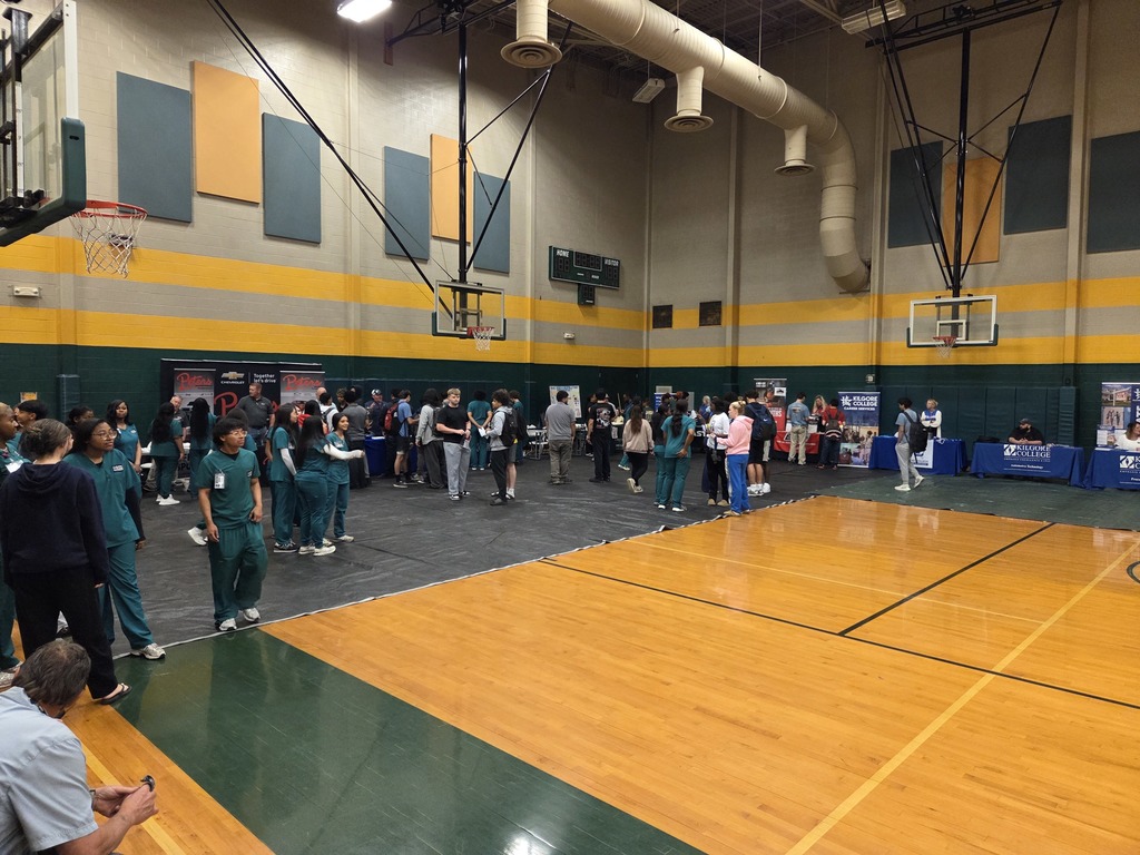 Students interacting with various career booths