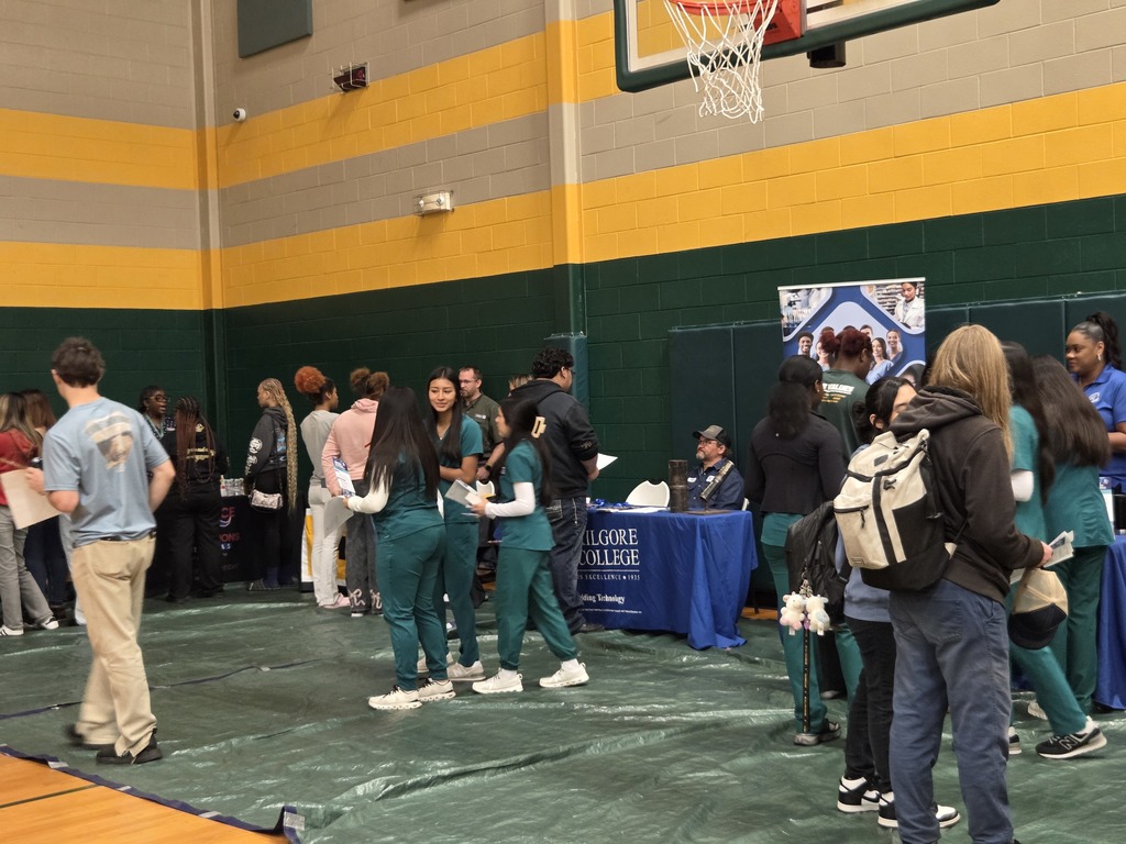 Students interacting with various career booths