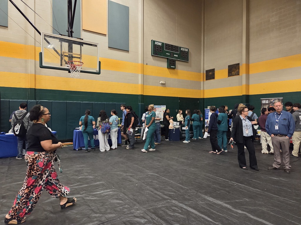 Students interacting with various career booths