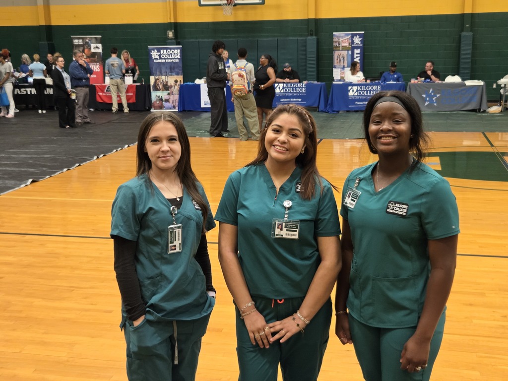 3 health science students smiling for the camera